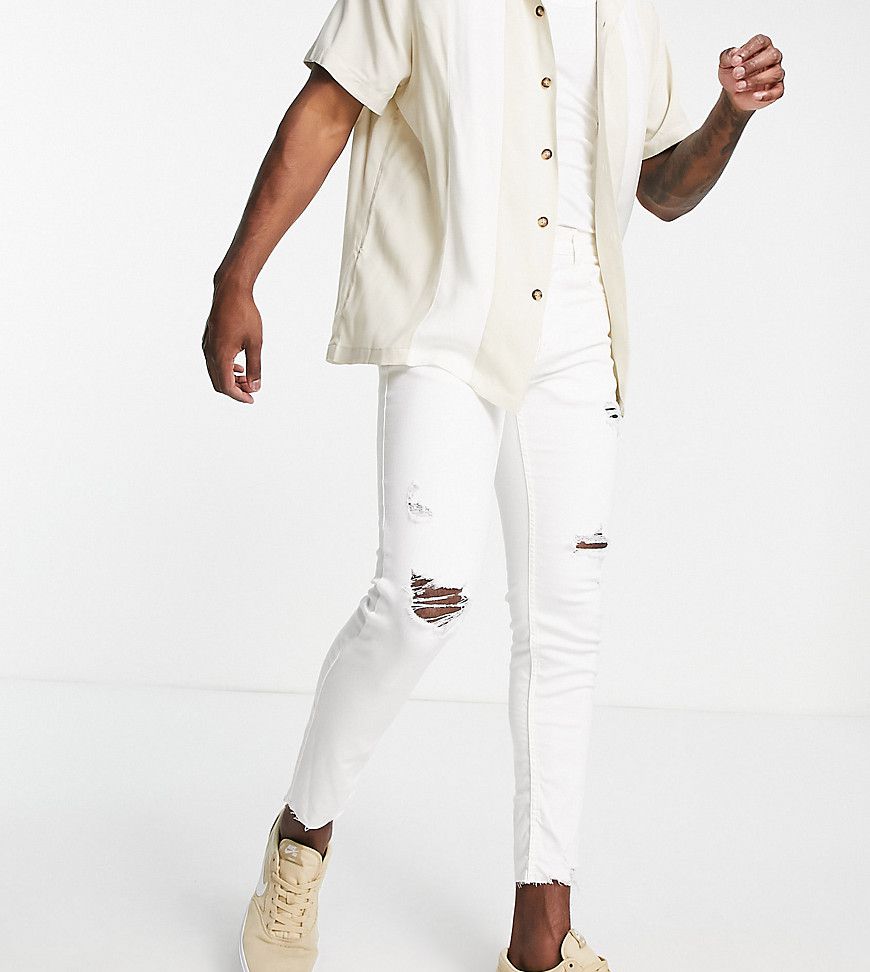 Jeans skinny bianchi con strappi - In esclusiva per ASOS - Pull & Bear - Modalova