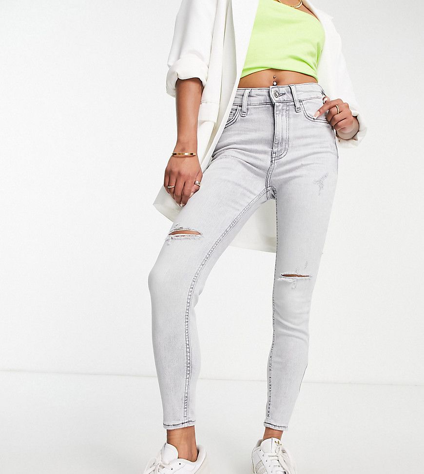 Jeans skinny a vita alta chiaro modellanti - River Island Petite - Modalova