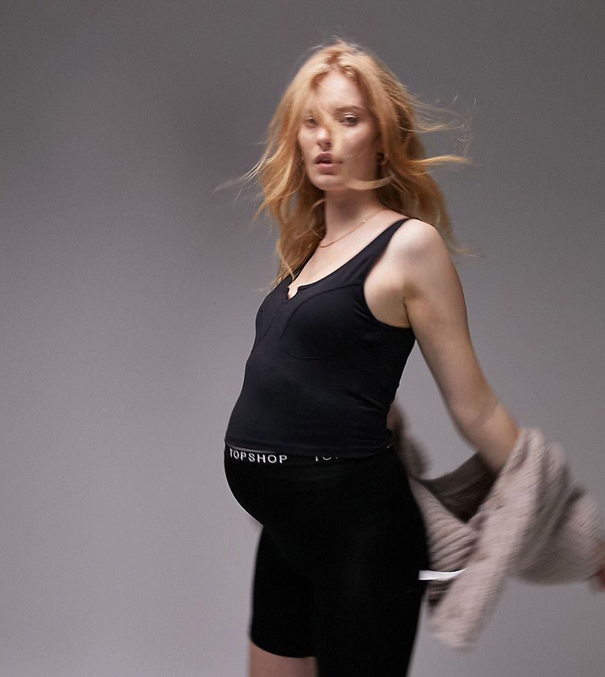 Pantaloncini leggings neri con fascia elasticizzata con logo - Topshop Maternity - Modalova